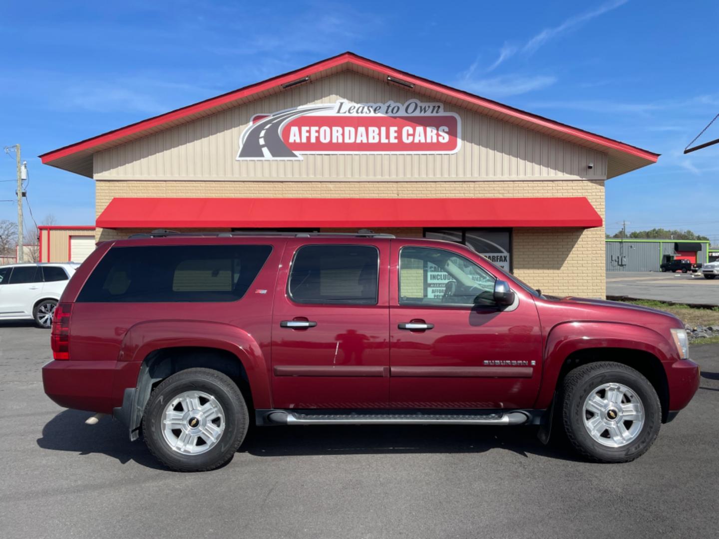 2008 Maroon Chevrolet Suburban 1500 (3GNFK16348G) with an V8, 5.3 Liter engine, Automatic, 4-Spd w/Overdrive transmission, located at 8008 Warden Rd, Sherwood, AR, 72120, (501) 801-6100, 34.830078, -92.186684 - Photo#0